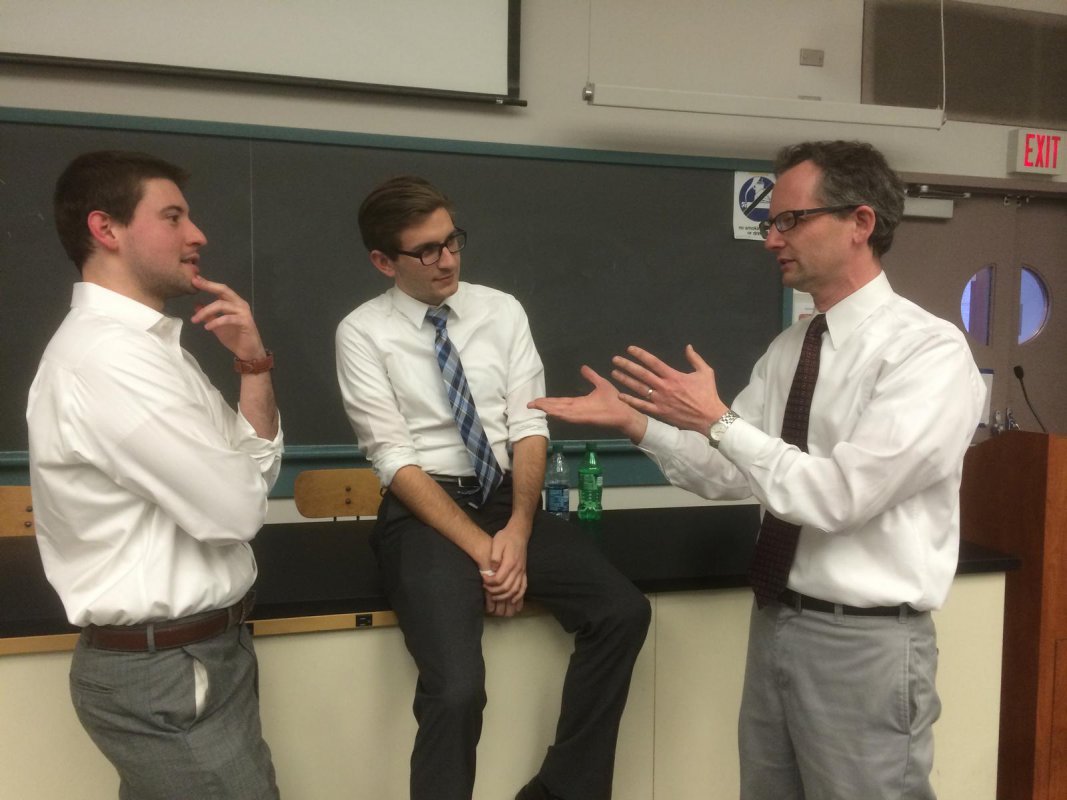 2014 CUA alumni Drake Starling from World Bank, and Zach Dupont from Office of Rep. Richard Neal, exchange opinions about working in DC with Dr. Green.