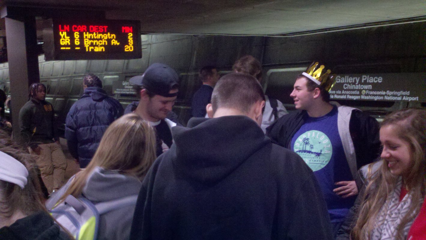 CUA students wait for the Metro train on their way toward the Smithsonian National Air and Space Museum.